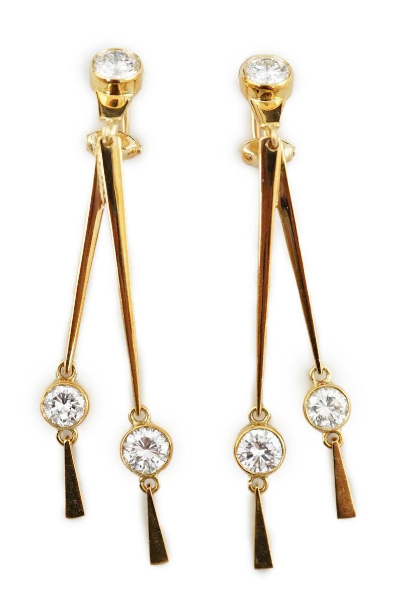 A pair of modern 18ct gold and three stone diamond set double drop ear clips